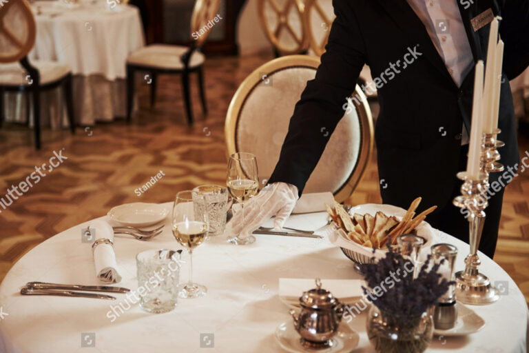 stock-photo-professional-waiter-preparing-the-table-in-the-vintage-style-luxure-restaurant-1520628356